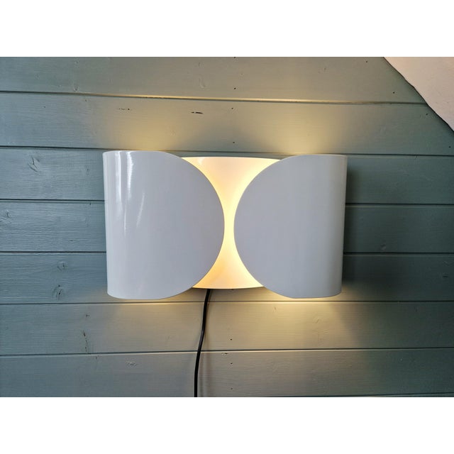 Large flos wall sconce, foglio model, in white lacquered metal, designed by italian designer tobia scarpa in 1966....