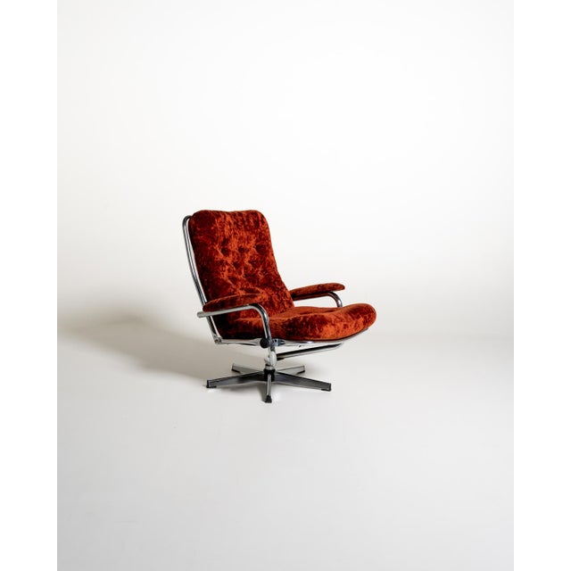 Rust-colored velvet, chromed metal tubular frame, five-star swivel base, and adjustable backrest. Made in Sweden, 1970s....