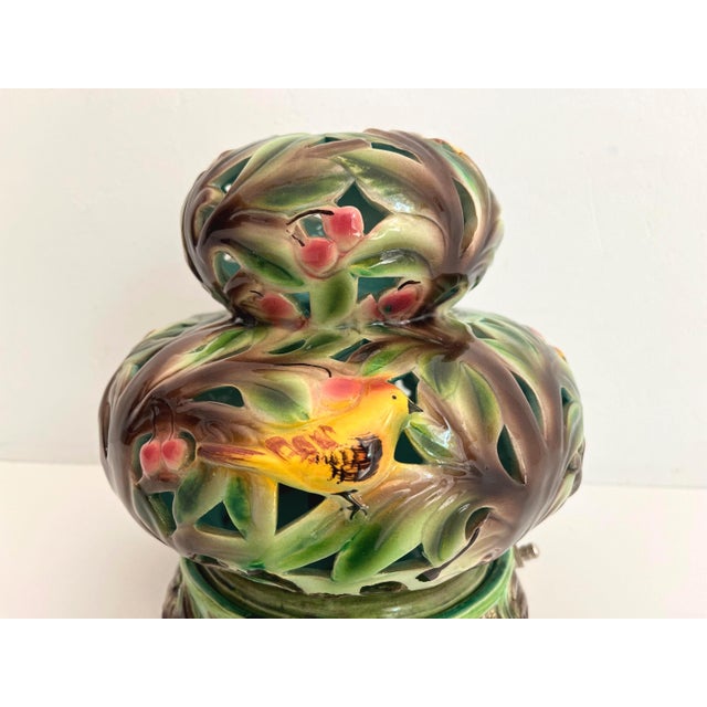 Gorgeous mid century two-piece Italian accent lamp of glazed and pierced porcelain ceramic depicting richly colored...