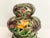 Gorgeous mid century two-piece Italian accent lamp of glazed and pierced porcelain ceramic depicting richly colored...
