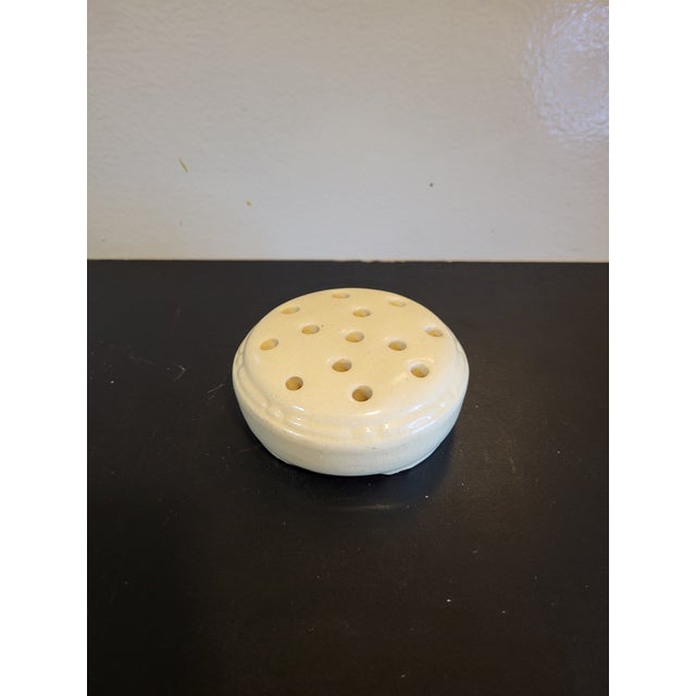 Vintage ceramic round flower frog. Good vintage condition with some visible crazing and base water stains.