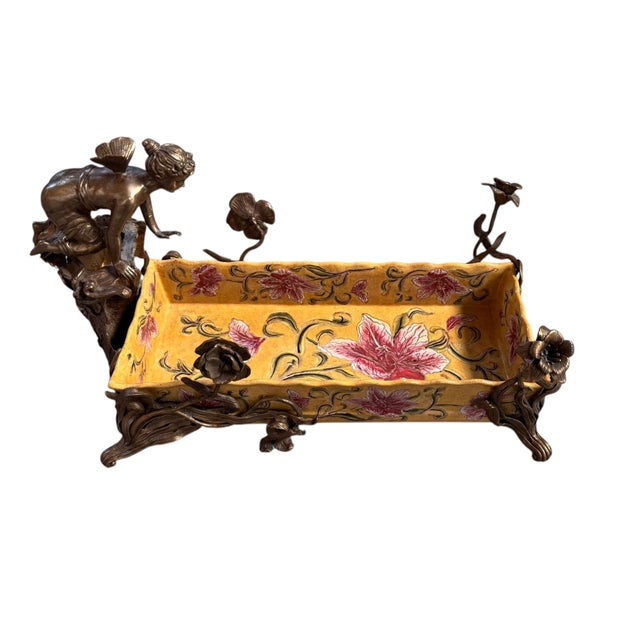 17 1/2”W x 11”H x 9”D This exquisite centerpiece from Wong Lee International masterfully unites the flowing elegance of...