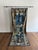 A French antique tapestry featuring elaborate ornamentation and finely woven details. Its rich design and graceful patina...