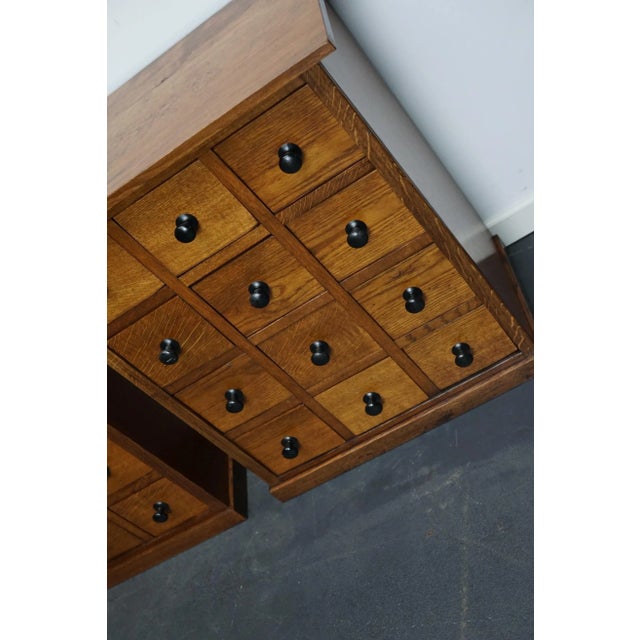 Very nice pair of small French oak cabinets with metal hardware made in the early 20th century. They are very well made...