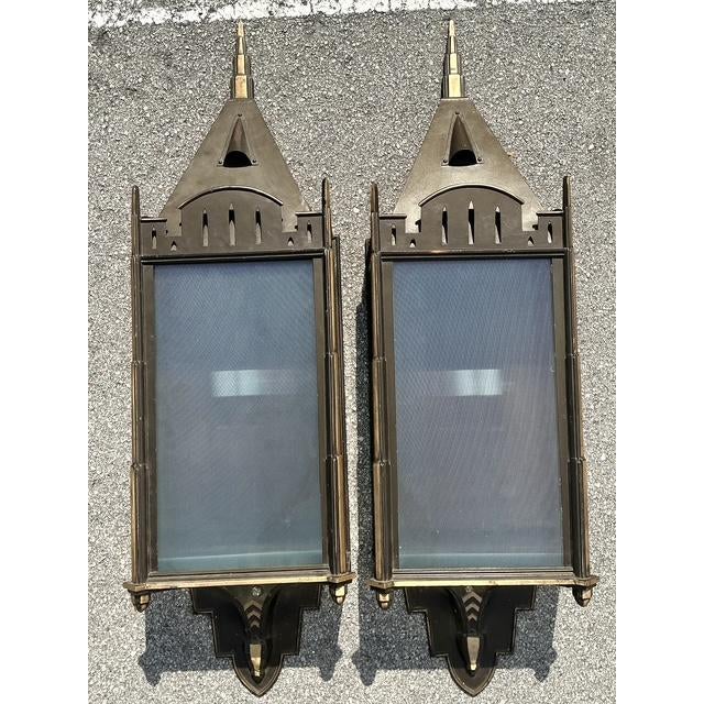 These monumental wall sconces are a rare example of dramatic architectural lighting, masterfully blending Art Deco...