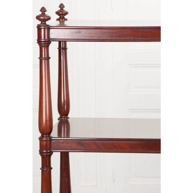 An English tea trolley of epic proportions, this 19th century mahogany antique is grand in scale, likely used in a...