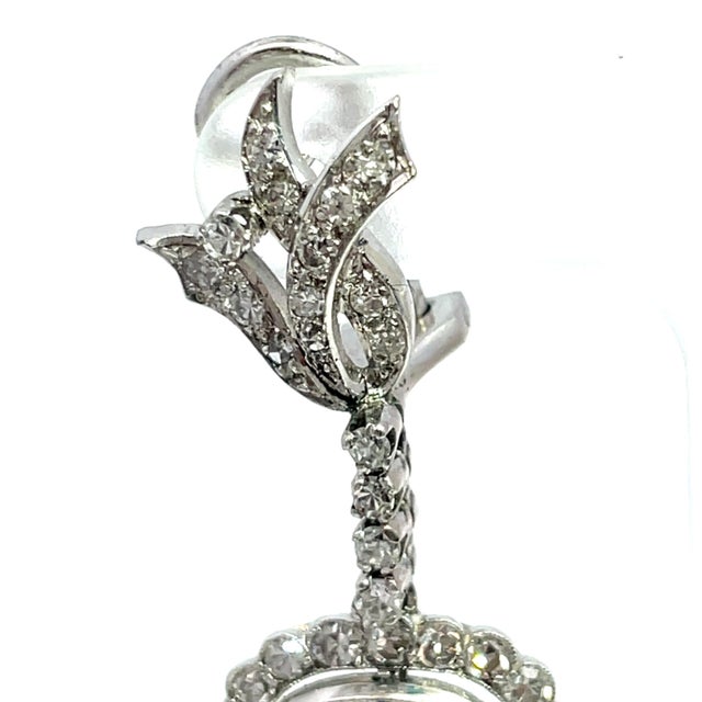 Elevate your elegance with these stunning Vintage Dangle Earrings, crafted from luxurious 10k white gold. Adorned with...