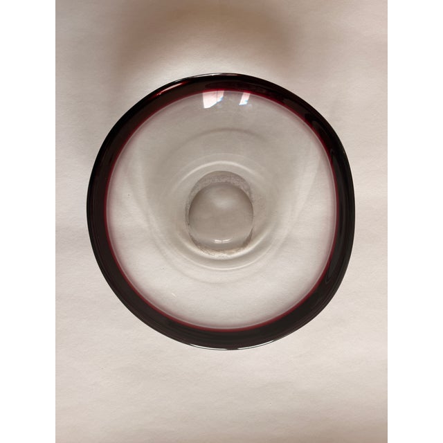 Two-piece art glass set from the 1950s in deep amethyst/aubergine tones. • large, organically curved bowl made using the...