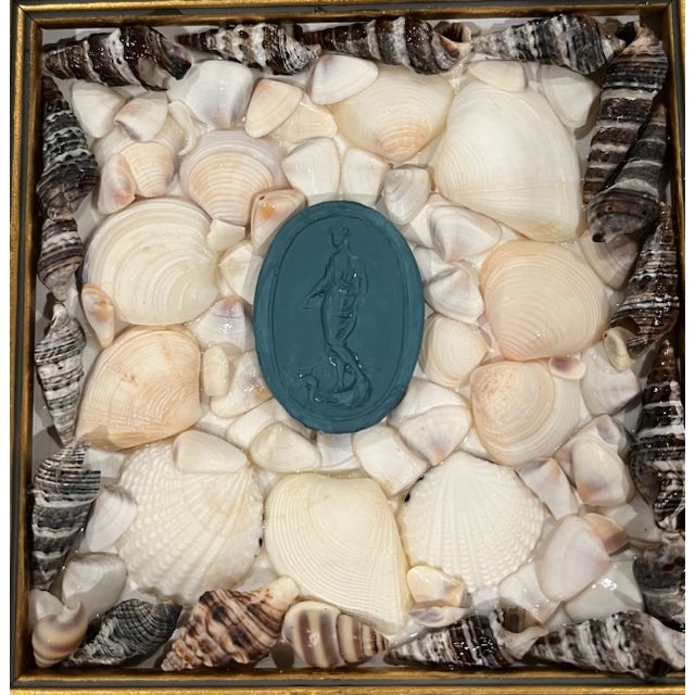Grand Tour style contemporary intaglio of sea goddess in marine plaster, surrounded by seashells in a gold wood frame....