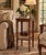 Elegant vintage walnut two-tier side table featuring a warm, rich wood finish, a square top with molded edges, and a...