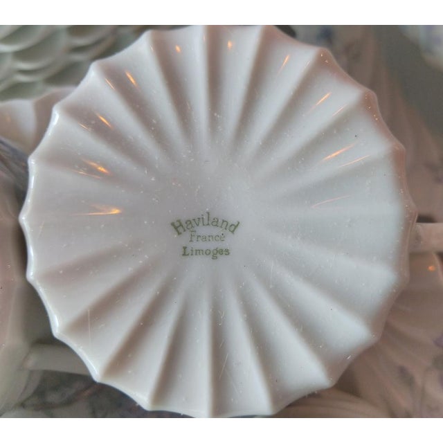 Large dinner service from the prestigious Haviland Limoges porcelain house with its iconic torso dinner service here...