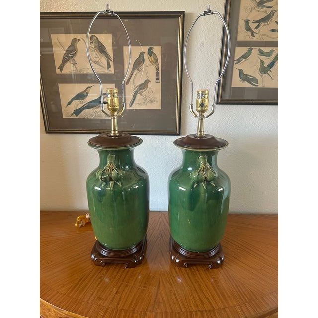 Exceptional matched pair of vintage ceramic table lamps featuring beautifully proportioned urn-form bodies finished in a...