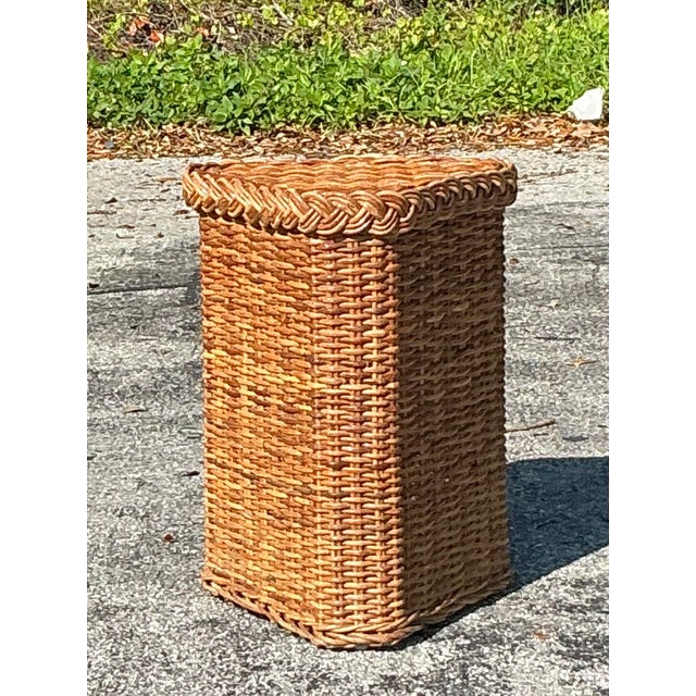 Bring a touch of natural elegance to your space with this vintage coastal braided rattan pedestal. Beautifully handwoven...