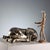 A silver-plated sculpture depicting a crouching young antelope. Engraved silver hallmarks. Net weight: 260 grams. This...