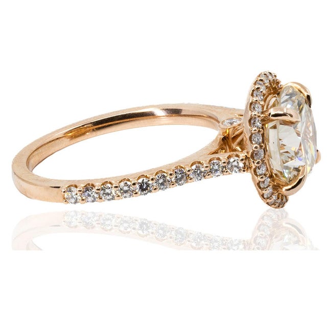 14k Rose gold ring set with 2.80 carat GIA certified O-P color VS1 clarity round diamond 48 smaller round diamonds...