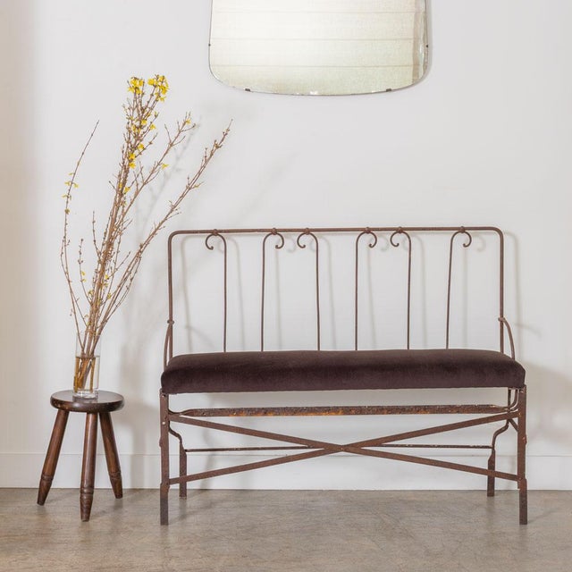 Lovely wrought iron bench from France, 1940s. Beautiful scroll iron design on slated iron back. Newly upholstered espresso...