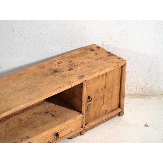 Antique low sideboard in pine wood, traditional Chinese furniture originating from Gansu and dated circa 1930. Originates...