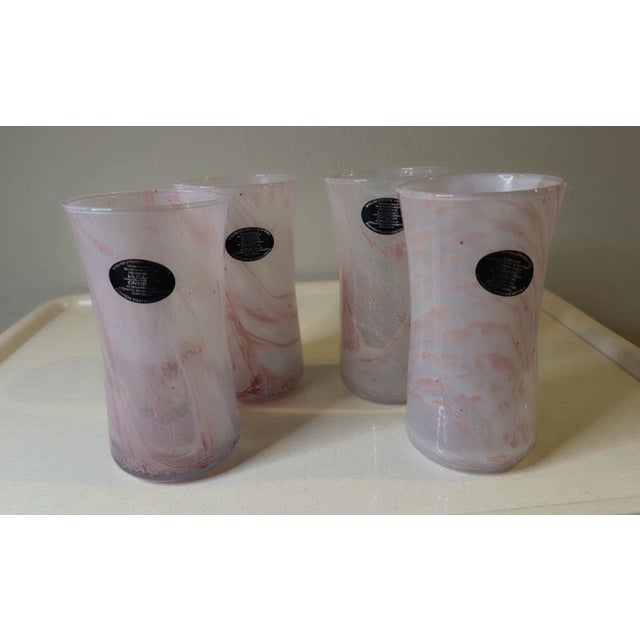 Add a beautiful pop of Italian color to your table with this **set of 4 Nuova Cristalleria Arzanese Pink Drinking...