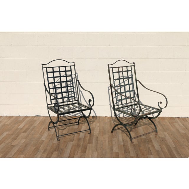 Authentic vintage pair of wrought iron folding patio armchairs attributed to Hervé Baume, France, 1970s. These beautifully...