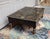 Very charming rustic coffee table is beautifully hand painted in a folk art type of style. Sturdy heavy solid wood table....