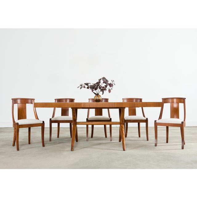 Exceptional set of six French art deco gondola dining chairs crafted from radiant mahogany. The chairs are made in the...