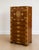 An exceptional English Campaign secretary chest crafted in richly figured walnut with striking solid brass corner mounts,...
