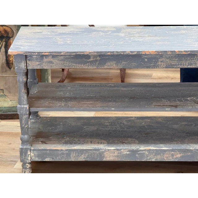 French Vintage draper’s table having one shelf, blue polychrome. Purchased in Provence, c. 1930. 29.5" h. x 67.25" w. x...