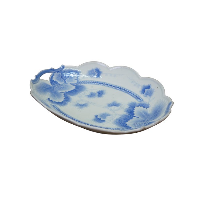 Antique blue and white serving platter / tray / shallow dish featuring a maple leaf motif with scalloped rim and handles....