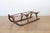 A French rustic wooden sled from the 19th century with curving extremities. Charming our eyes with its rustic appearance...