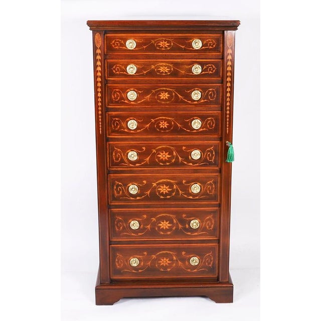 This is a fabulous antique late victorian flame mahogany with scrolling satin wood marquetry decoration, wellington chest,...