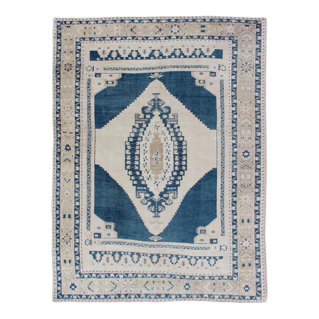 Vintage Hand Knotted Turkish Oushak Rug With Central Medallion in Blue and Cream For Sale