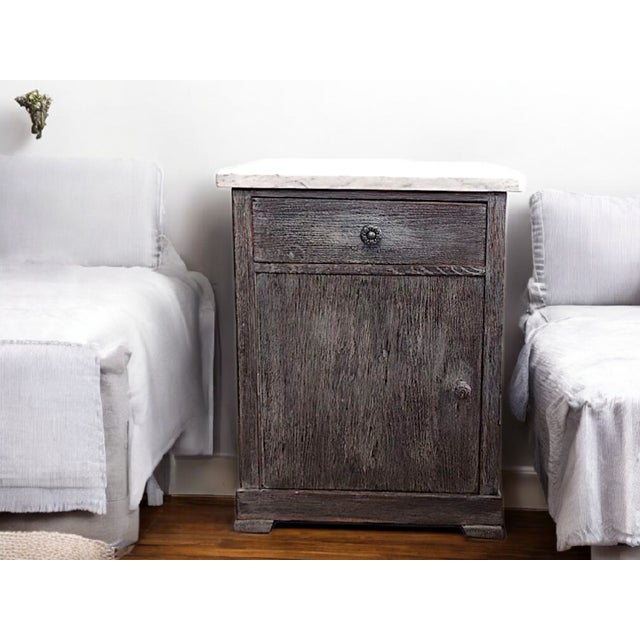 This exceptional pair of restored vintage bedside tables combines timeless simplicity with the natural elegance of genuine...
