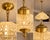 This elegant circa 1960 French chandelier combines warm gold-toned bronze with a beautifully faceted crystal dome,...