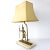 Very rare table lamp with a brass Egyptian warrior walking on a marble base. The shade, which is gold colored on the...