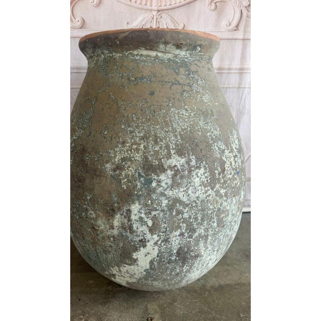 An evocative and highly atmospheric Mediterranean style olive jar, celebrated for its profound, worn character and...