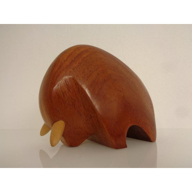 Bull made of solid teak from the 1950s. I have official proof of authenticity such as vintage catalogs, designer records,...
