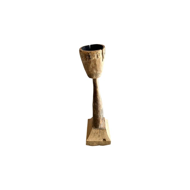 A striking relic of the 19th century, this hand-carved wooden torch is a rare and captivating piece of rustic décor. Its...