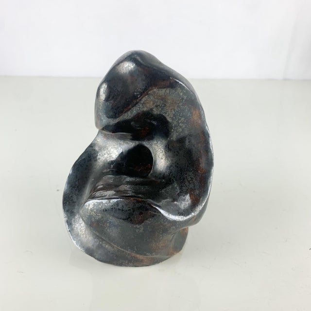 Fabulous vintage one of a kind art sculpture in clay. Abstract figure with shiny black, bronze and brown glaze. Love the...