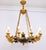 A striking and highly decorative french empire–style chandelier featuring 12 elegantly sculpted bronze swan arms. The...