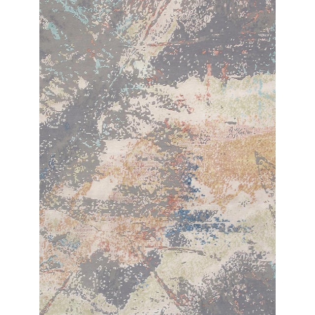 The Modern Collection explores hand-knotted designs through abstract patterning, solid tonal fields, and subtle surface...