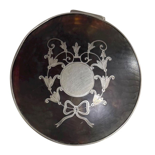 An elegant English Birmingham silver and faux tortoise shell box, hallmarked Birmingham, 1922, with maker’s mark L&S. This...