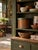 An antique American bentwood pantry box featuring a warm, naturally aged wood finish and original muted green painted...