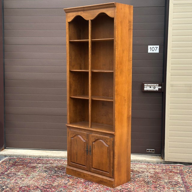 Ethen Allen Heirloom Maple Tall Bookcase With Cabinet complete with three adjustable shelves one which fits inside the...