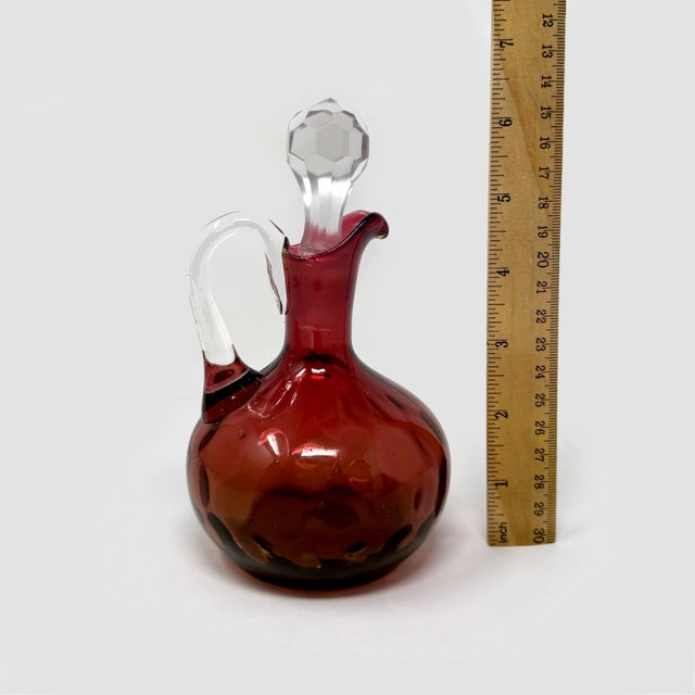 Up for sale is an exceptional, authentic antique Victorian (Circa 1880–1900) Amberina Coinspot art glass cruet, standing...