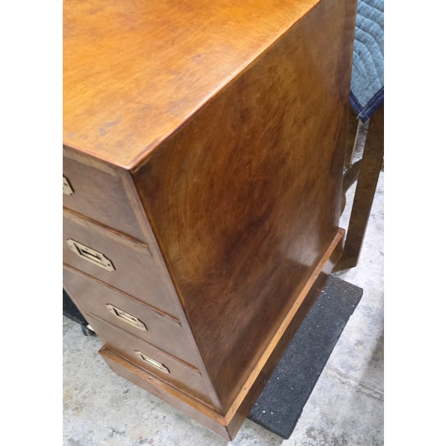 This Vintage Burlwood Campaign Kneehole Desk is a distinguished and classic piece with a lot of nuanced character and...