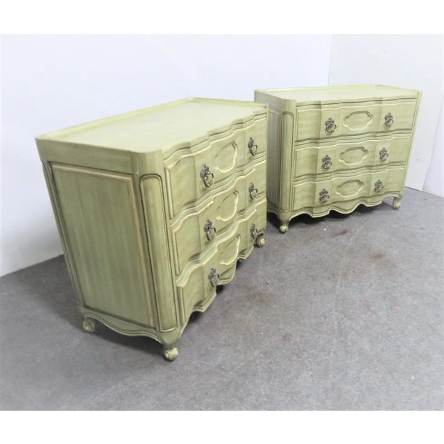 A pair of Louis XV style commodes made by White Furniture Company. Features 3 drawers with brass hardware, green and cream...