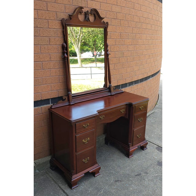 A Mid-Century Chippendale Style Mahogany Vanity Table with Mirror in very good vintage condition. Measures 48" in width,...