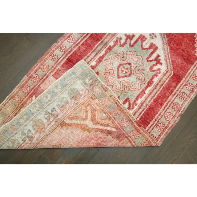 A red and pink striated mid 20th century Turkish Anatolian Carpert