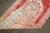 A red and pink striated mid 20th century Turkish Anatolian Carpert