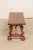 A Spanish wooden coffee table, with lyre legs and iron stretcher, from the turn of the 19th and 20th century. This antique...